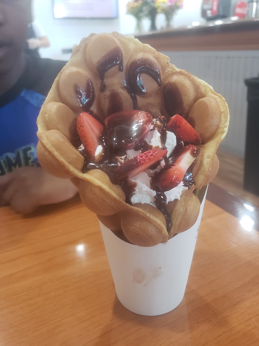 A bubble waffle with strawberries and chocolate at Tea Town